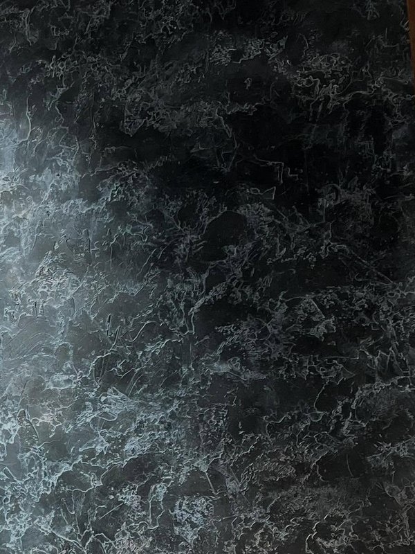 Deep teal plaster with high-contrast marbled veining